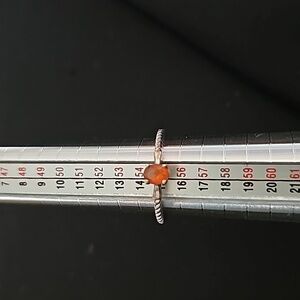 Sterling silver ring with orange center stone